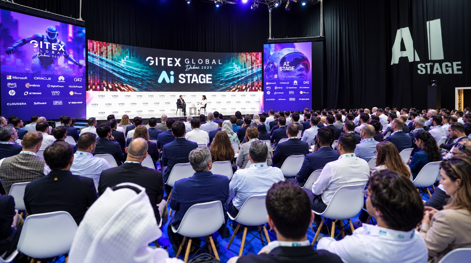 Woman interacting with a humanoid robot at an AI exhibition